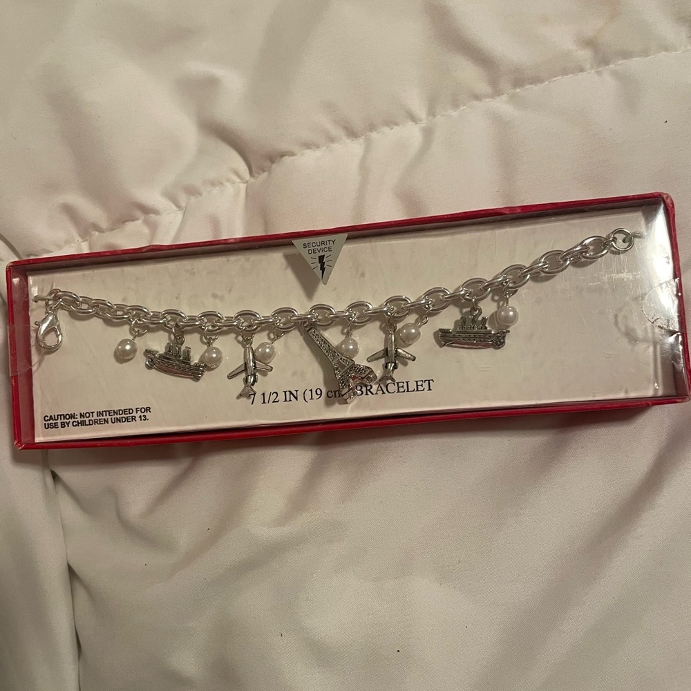 Eiffel Tower, airplane and boat charm bracelet.